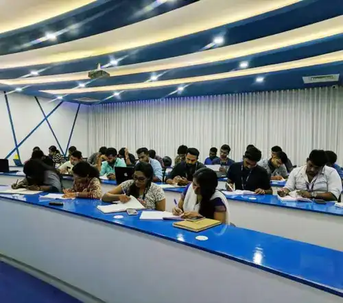 Students in an IHRA classroom session working through HR course modules